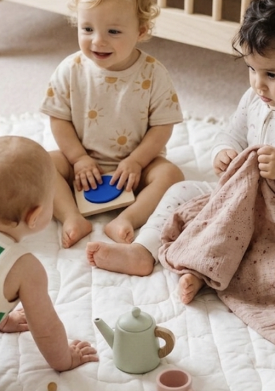 Toddlers playing together in a family home